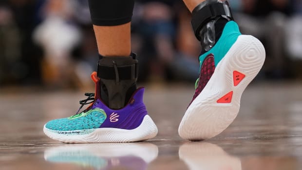 Golden State Warriors point guard Stephen Curry wearing the Curry Flow 9 'Black History Month'.